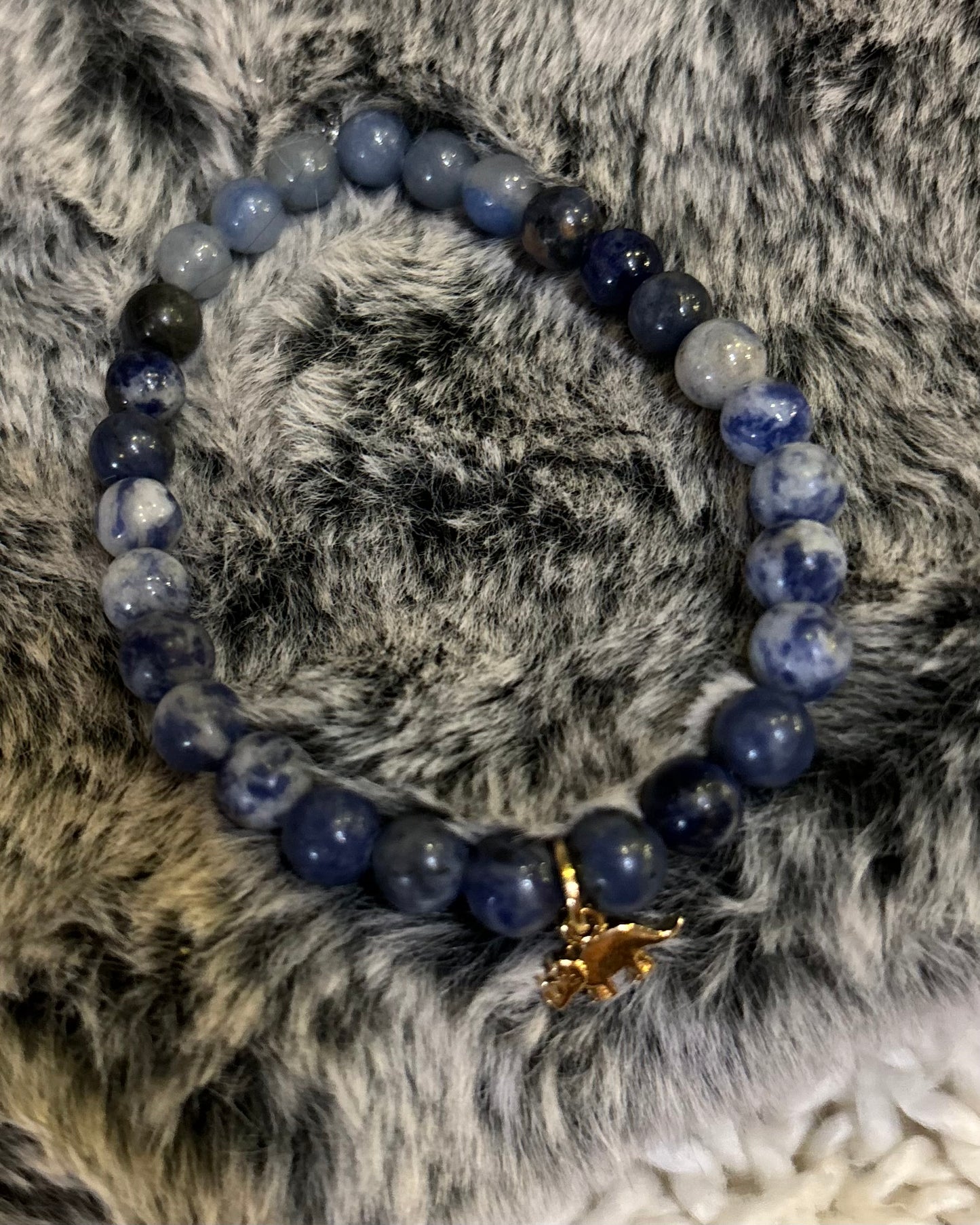 Blue triceratops mala bracelet