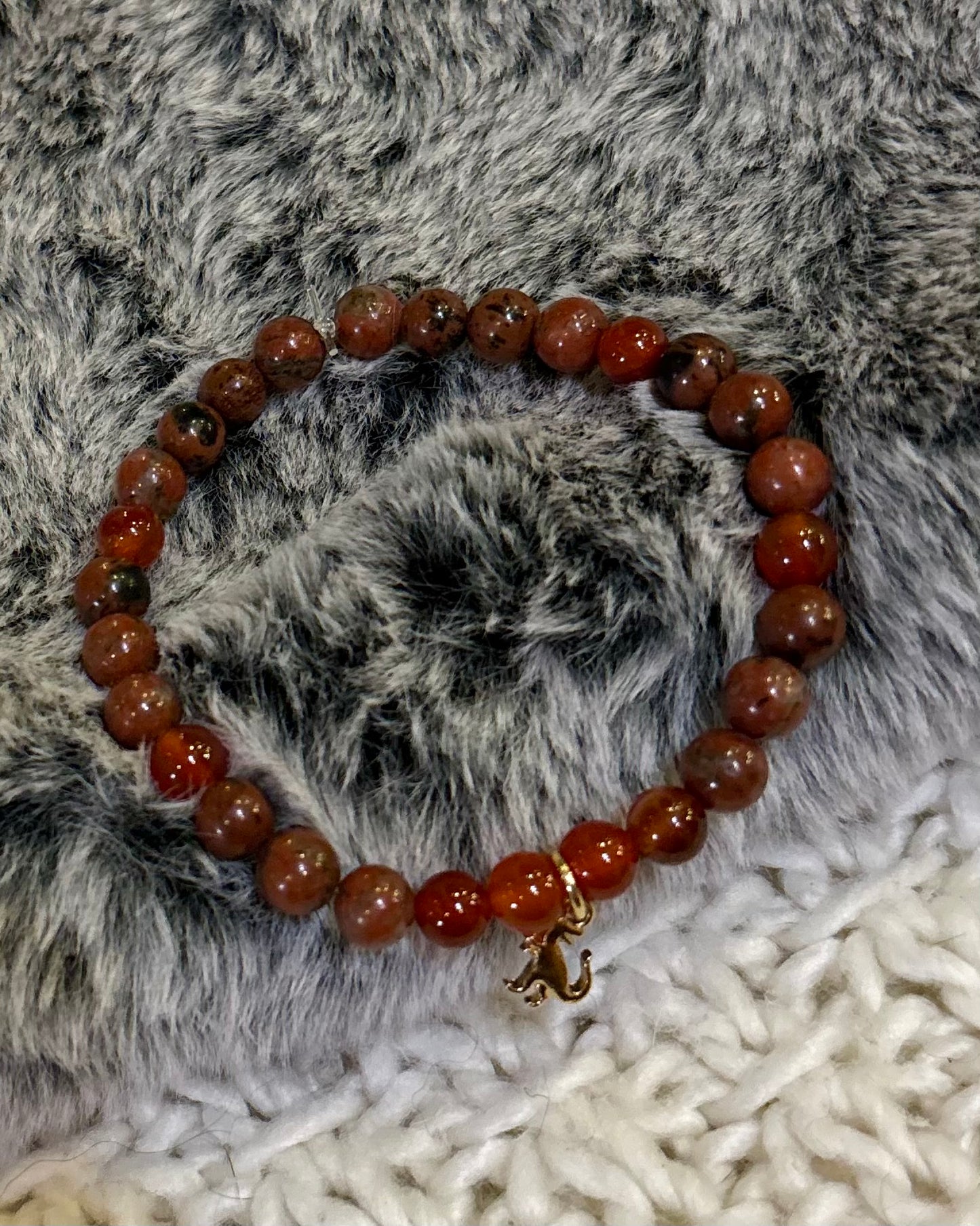 Red raptor mala bracelet